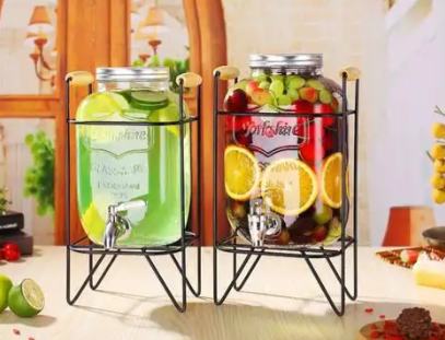  Glass juice jug with metal stand